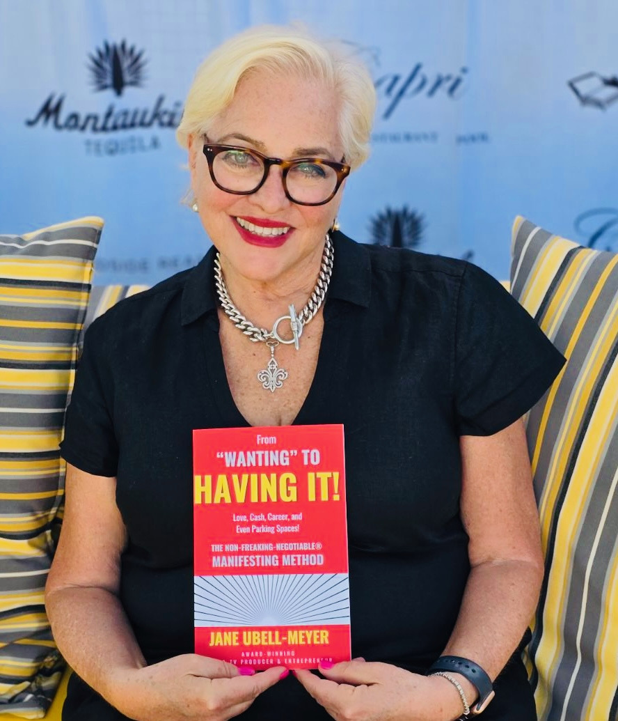 Jane Ubell-Meyer holding her book From Wanting to Having It.